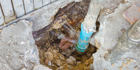 A leaking main water line, underground